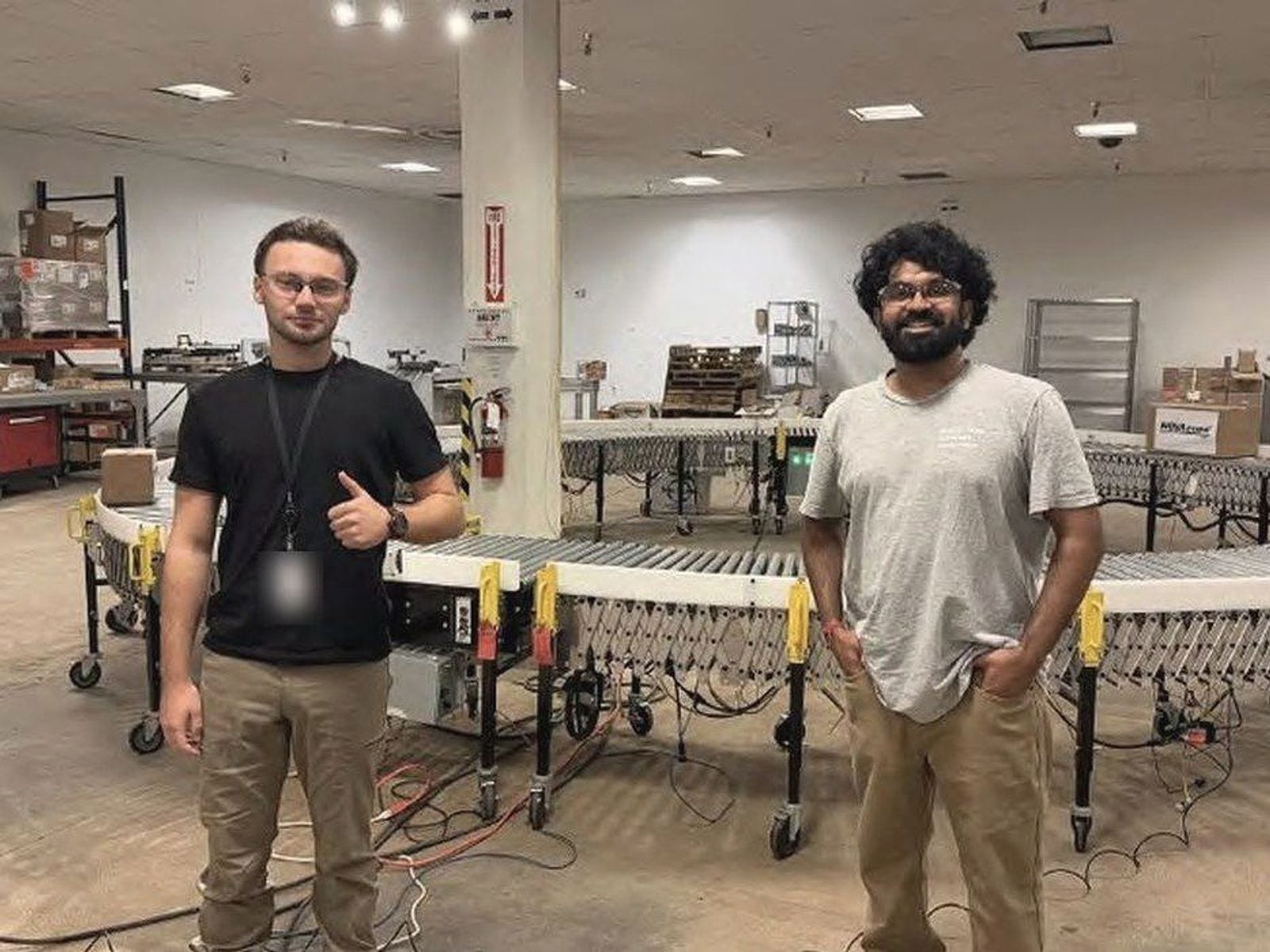 Andrew DiMaggio and Nischay Madappa on a plant floor