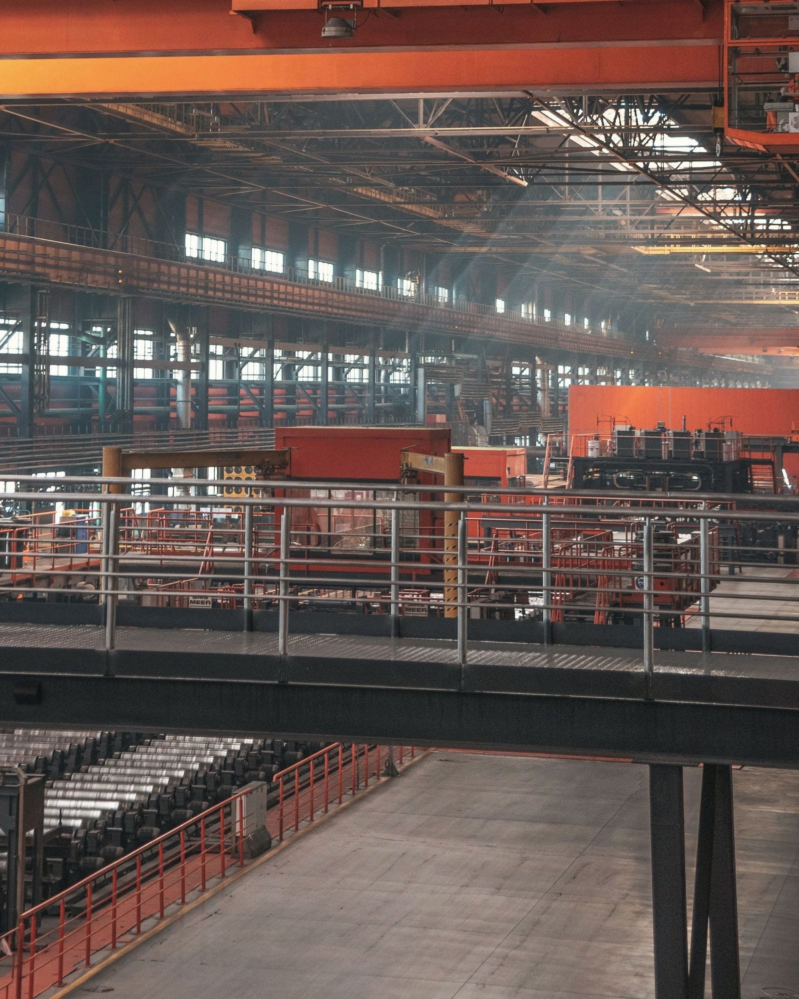 Steel plant interior with overhead crane and walkways